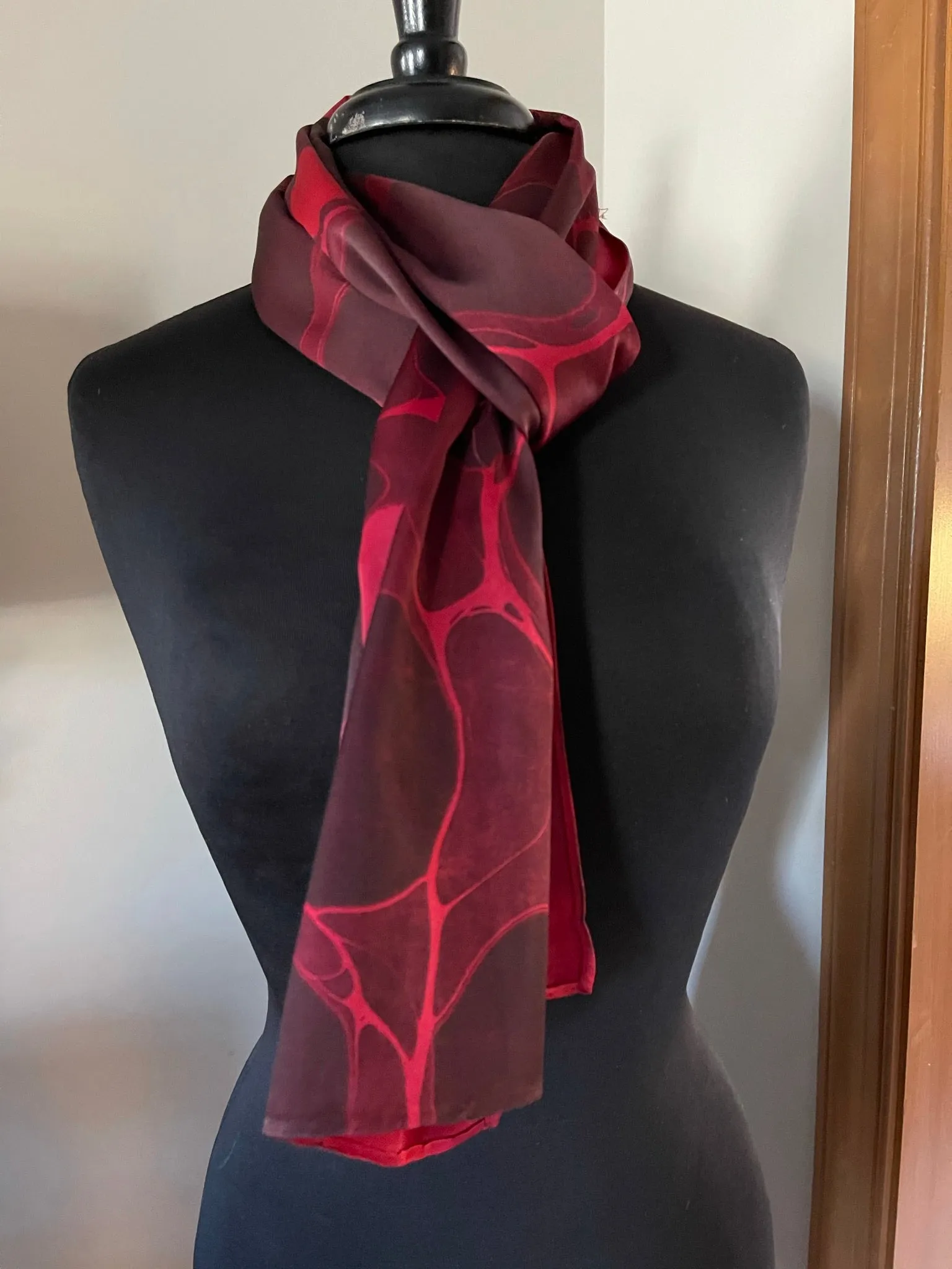 Red stone  marbled Charmeuse  Silk 72x14” bold fun. This beautiful silk makes a unique dresser cover and scarf