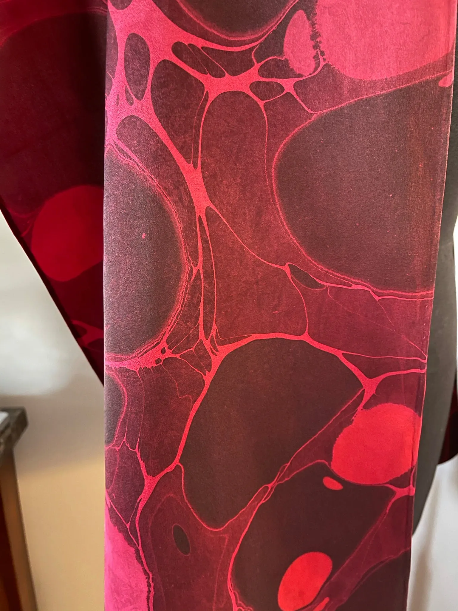 Red stone  marbled Charmeuse  Silk 72x14” bold fun. This beautiful silk makes a unique dresser cover and scarf