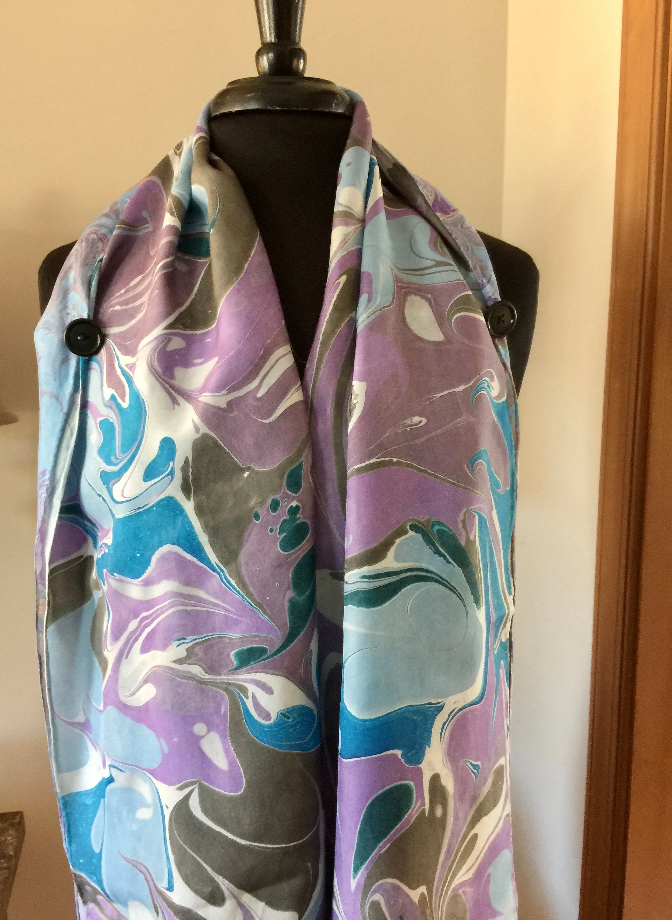 The Shibumi.  It’s a wrap, a shawl, a fashion statement!  Wear it 10 different ways!